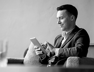 The lawyer is a man in a business suit sitting in a modern office.