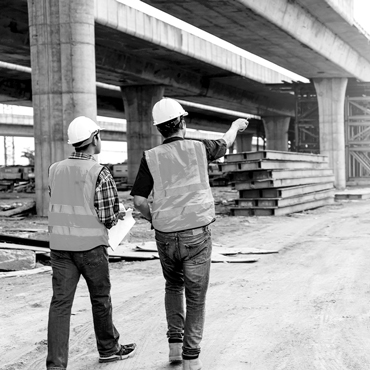 construction engineers discussion with architects at road construction site. Civil Engineer.