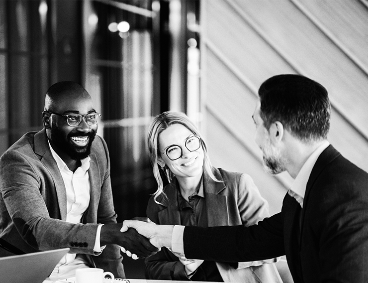 Three professionals in a meeting